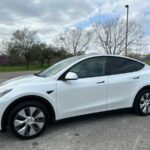 2023 White Tesla Model Y AWD Long Range – immaculate less than 5k miles